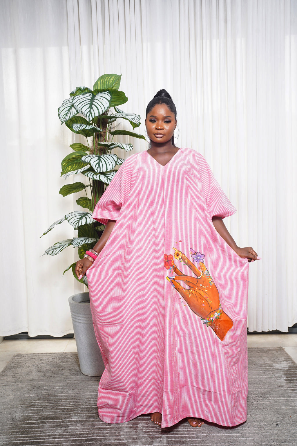 Woman wearing pink linen boubou dress by Selaro Luxury Wears